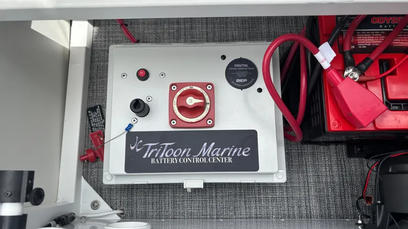 Slide: The Image of Battery control center of 2025 JC Sporttoon 27TT boat with wiring and controls. - 4