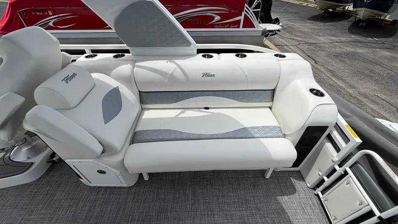 Slide: The Image of Luxury seating on 2025 JC Sporttoon 27TT pontoon boat, featuring white and gray upholstery. - 5