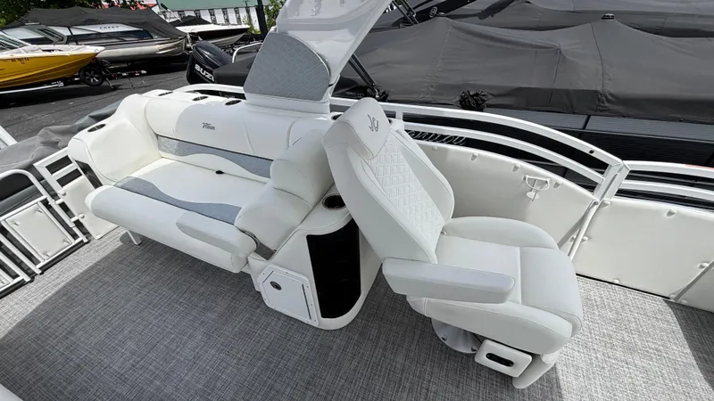Slide: The Image of 2025 JC Sporttoon 27TT boat interior with luxurious white seating and modern design. - 8