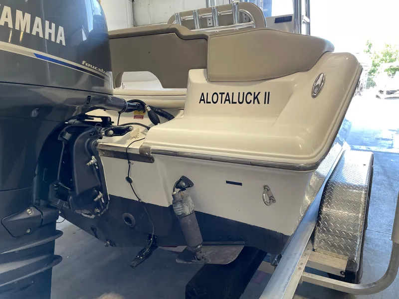 Slide: The Image of 2023 Key West 203 FS boat with Yamaha outboard motor in a garage. - 13