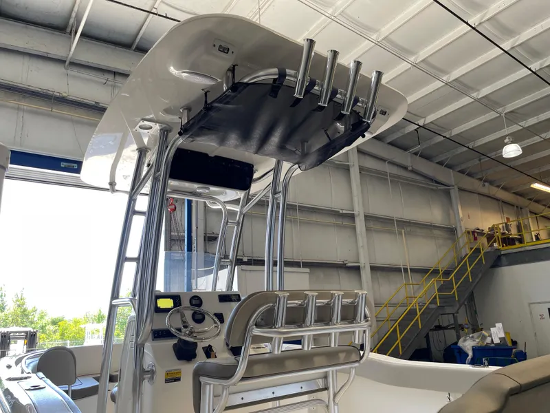 Slide: The Image of 2023 Key West 203 FS boat interior with T-top in a showroom. - 17