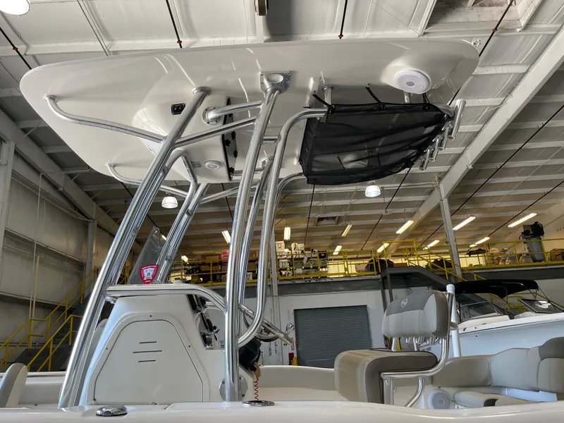 Slide: The Image of 2023 Key West 203 FS boat interior with cushioned seating and cup holders. - 18