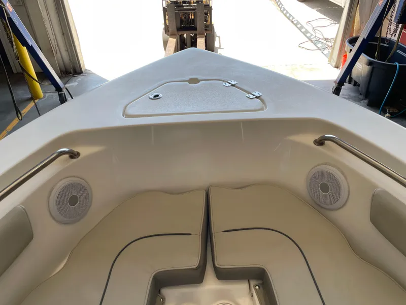 Slide: The Image of 2023 Key West 203 FS boat interior with cushioned seating and stainless steel supports. - 22