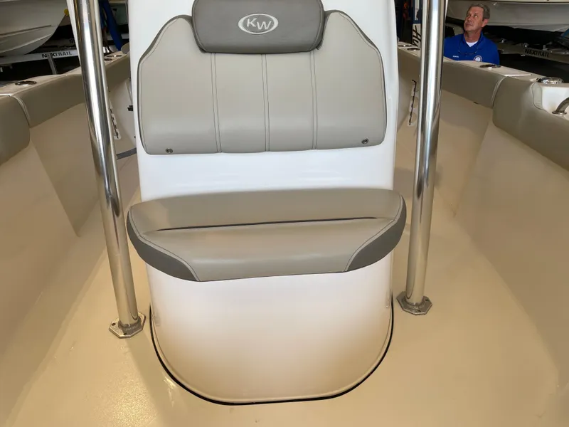 Slide: The Image of 2023 Key West 203 FS boat with T-top in a showroom. - 23