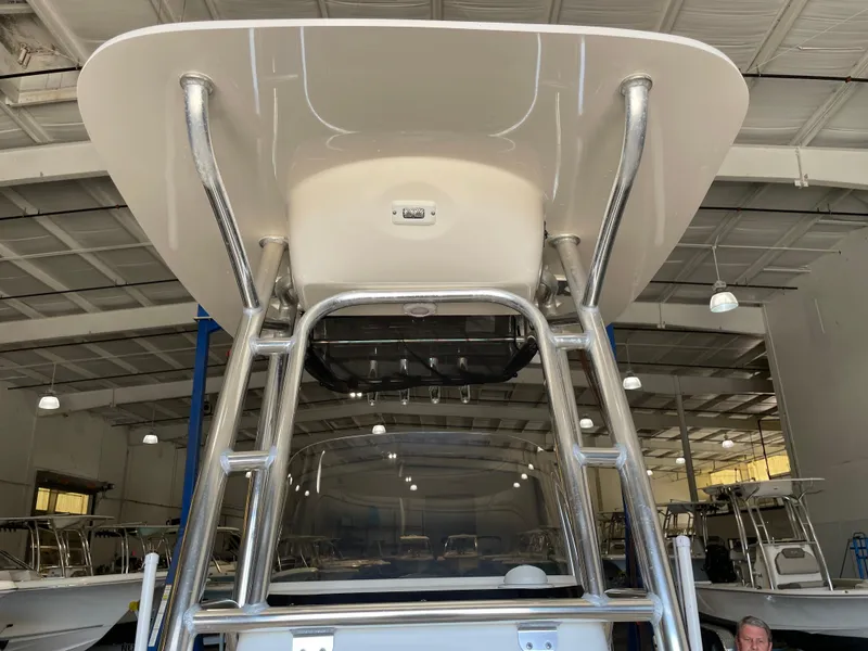 Slide: The Image of 2023 Key West 203 FS boat console with storage compartment and stainless steel railings. - 24