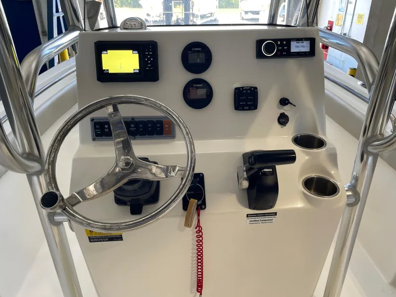 Slide: The Image of 2023 Key West 203 FS boat dashboard with Garmin navigation and control panel. - 27