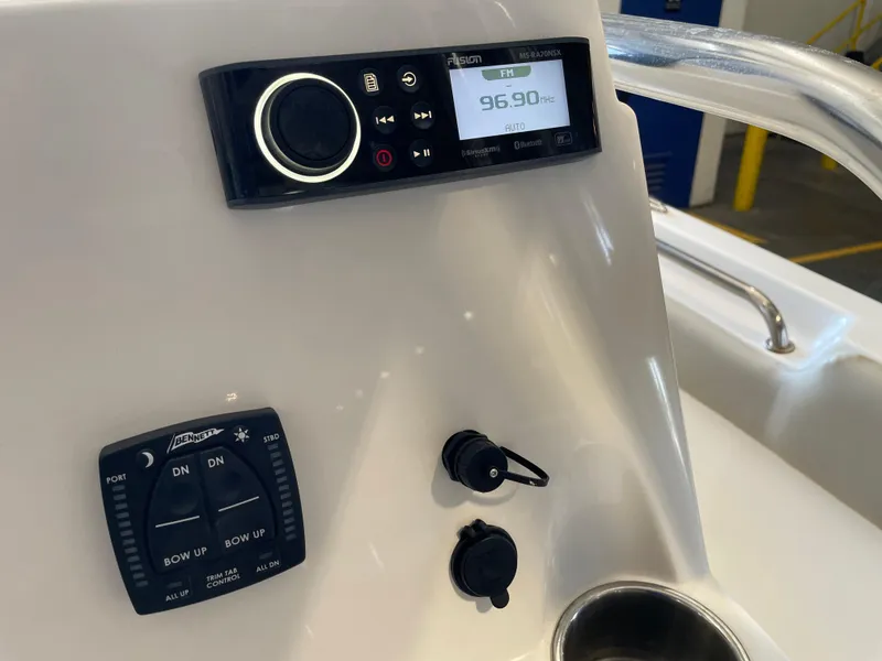 Slide: The Image of Steering wheel of 2023 Key West 203 FS boat with control panel and throttle. - 29