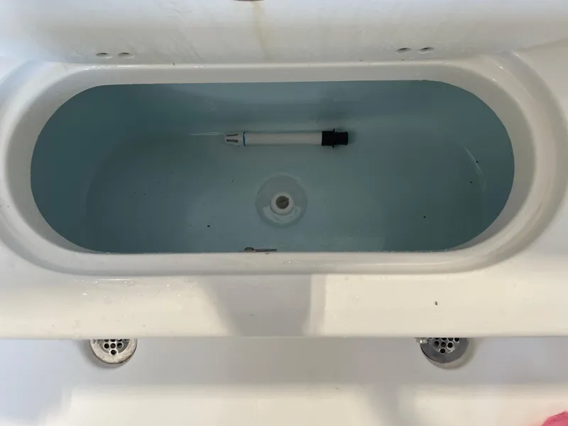 Slide: The Image of 2023 Key West 203 FS boat trailer in a garage setting. - 39