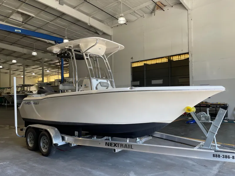 Slide: The Image of 2023 Key West 203 FS boat on trailer in indoor storage facility. - 4