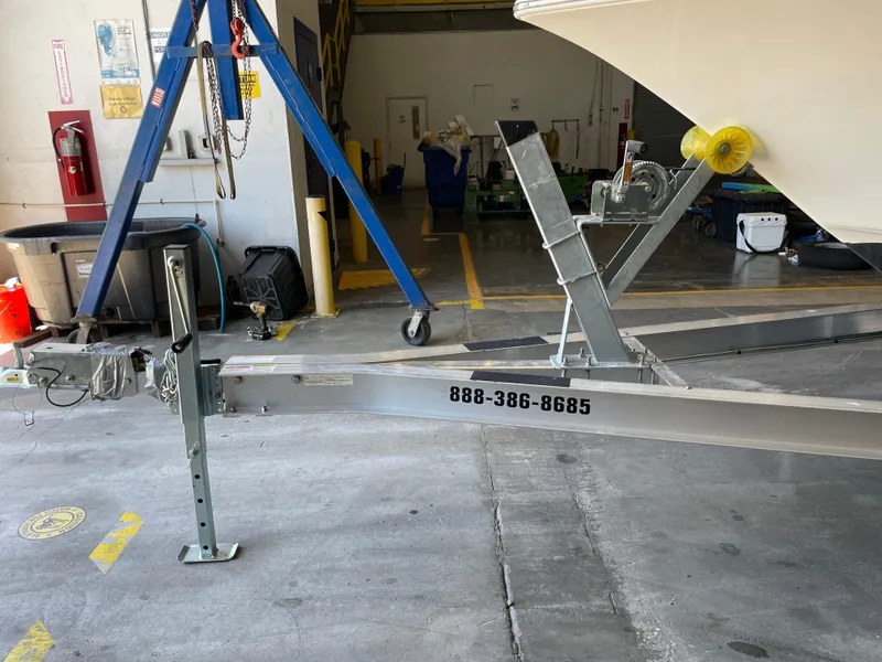 Slide: The Image of 2023 Key West 203 FS boat on NexTrail trailer in a garage. - 40