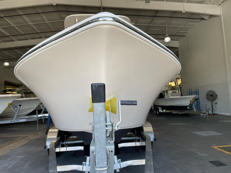 Slide: The Image of 2023 Key West 203 FS boat on trailer in a warehouse setting. - 8
