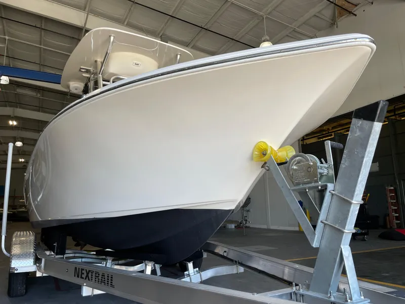 Slide: The Image of 2023 Key West 203 FS boat on trailer in indoor storage facility. - 9