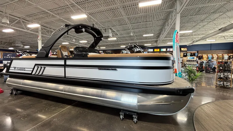 Slide: The Image of 2025 Viaggio Diamante D24UW A-T pontoon boat displayed in a showroom. - 1