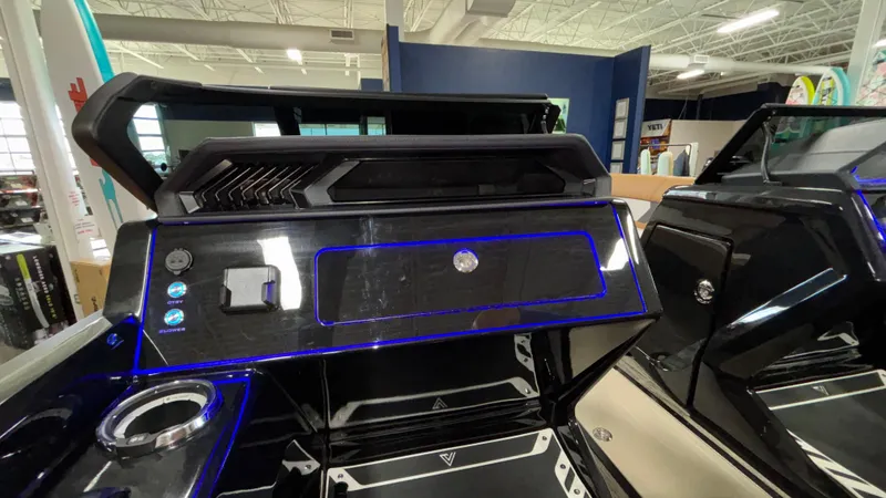 Slide: The Image of Interior of 2025 Viaggio Diamante D24UW A-T boat with modern dashboard and blue LED accents. - 18
