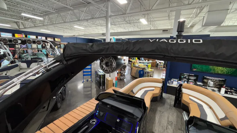 Slide: The Image of 2025 Viaggio Diamante D24UW A-T boat interior with modern seating and audio system. - 23