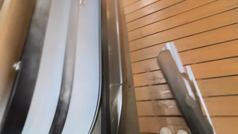 Slide: The Image of Wooden deck and sleek Viaggio Diamante D24UW A-T boat detail, 2025 model. - 27
