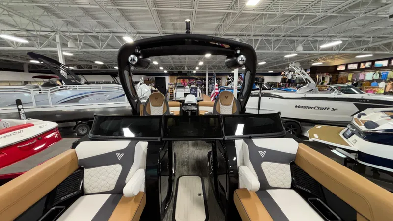 Slide: The Image of 2025 Viaggio Diamante D24UW A-T luxury boat interior in showroom, featuring modern seating and sleek design. - 34
