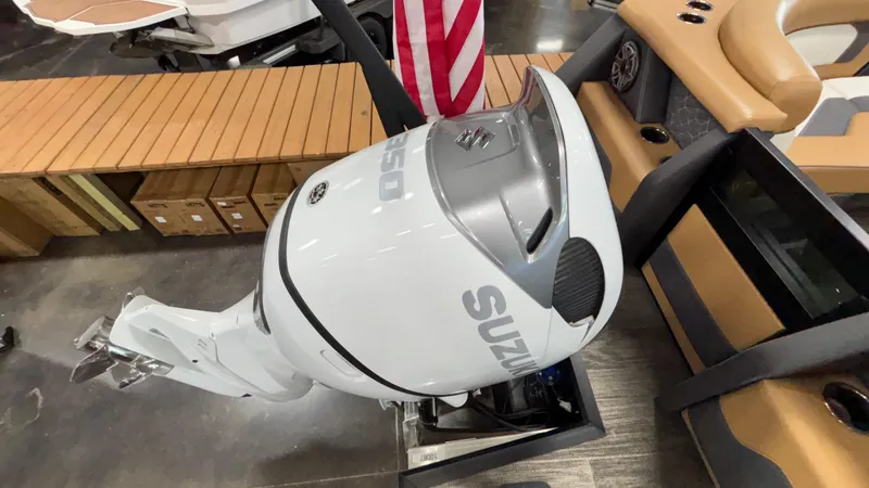 Slide: The Image of Outboard motor on Viaggio Diamante D24UW A-T, 2025 model, displayed indoors with American flag. - 7