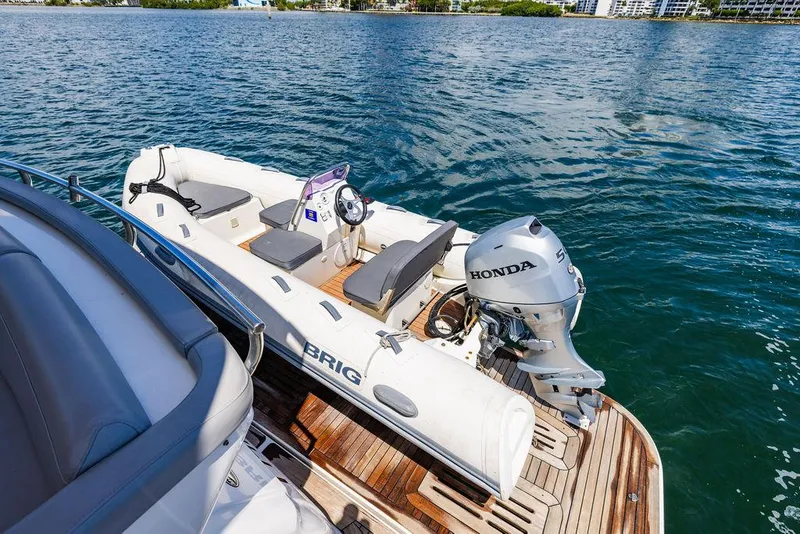 Slide: The Image of Luxury Sea Ray L650 Fly yacht with Brig tender and Honda outboard motor on water. - 12