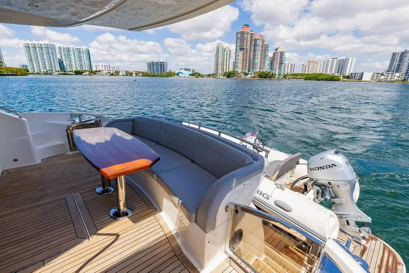 Slide: The Image of Luxurious 2016 Sea Ray L650 Fly yacht with scenic waterfront city view. - 13