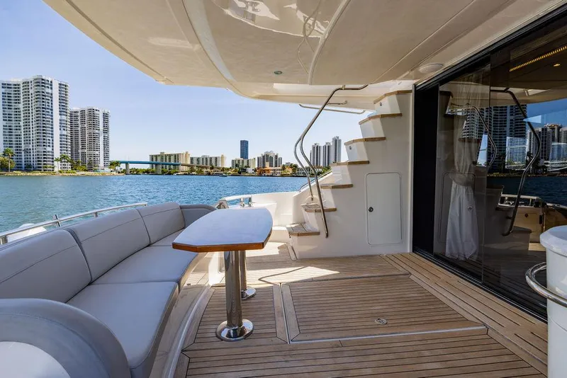 Slide: The Image of Luxurious 2016 Sea Ray L650 Fly yacht deck with city skyline view. - 14