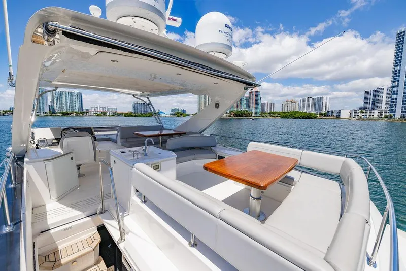 Slide: The Image of Luxurious 2016 Sea Ray L650 Fly yacht with spacious deck and scenic waterfront view. - 23