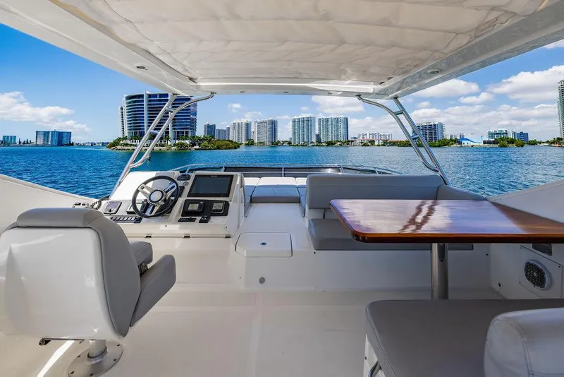 Slide: The Image of Luxurious 2016 Sea Ray L650 Fly yacht interior with city skyline view. - 30