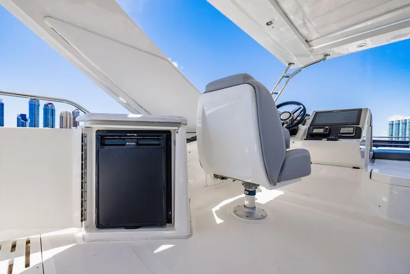 Slide: The Image of Flybridge of 2016 Sea Ray L650 Fly yacht with helm and seating. - 35