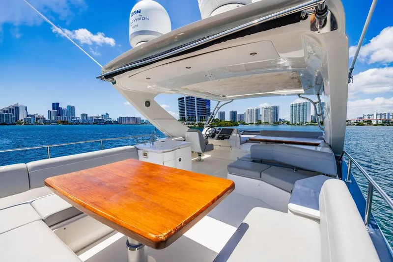 Slide: The Image of Luxurious 2016 Sea Ray L650 Fly yacht with spacious deck and city skyline view. - 37