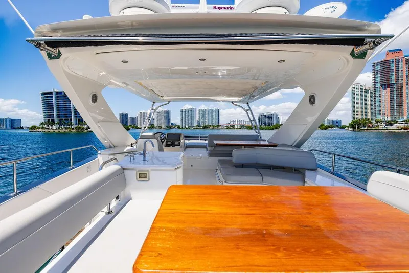 Slide: The Image of Luxurious 2016 Sea Ray L650 Fly yacht with spacious deck and scenic waterfront view. - 38