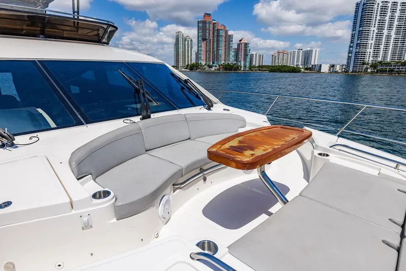 Slide: The Image of Luxurious 2016 Sea Ray L650 Fly yacht with elegant seating and scenic waterfront view. - 43