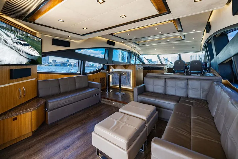 Slide: The Image of Luxurious interior of 2016 Sea Ray L650 Fly yacht with modern seating and large windows. - 46