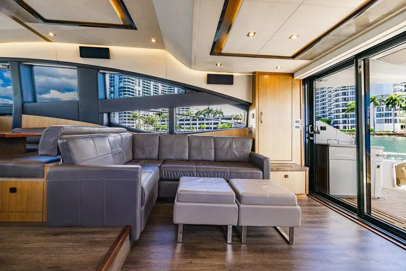 Slide: The Image of Luxurious interior of 2016 Sea Ray L650 Fly yacht with modern seating and scenic views. - 47