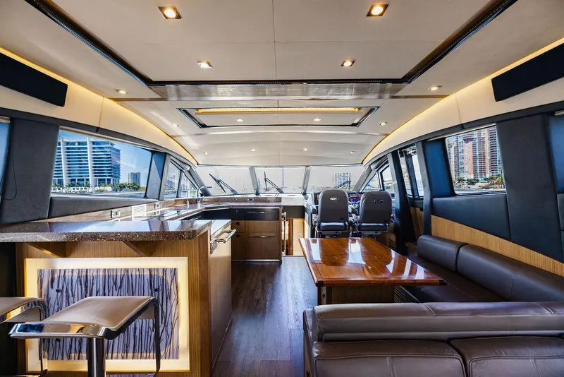 Slide: The Image of Luxurious interior of 2016 Sea Ray L650 Fly yacht with modern design and spacious seating. - 49