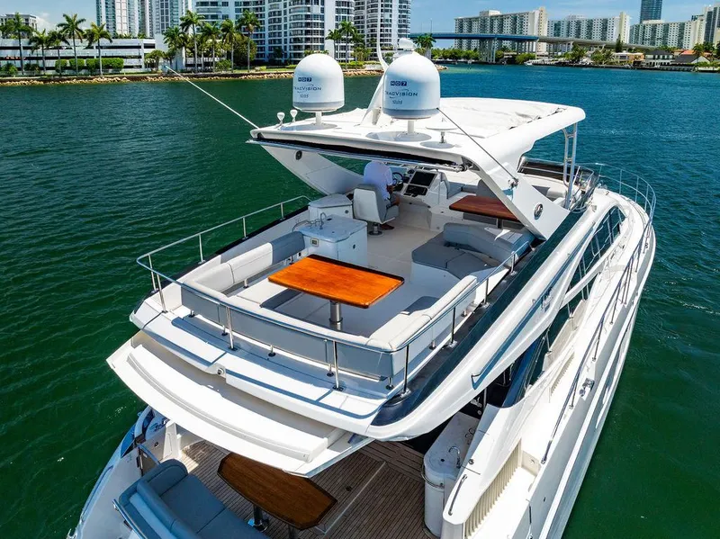 Slide: The Image of 2016 Sea Ray L650 Fly yacht with spacious flybridge on calm water. - 6