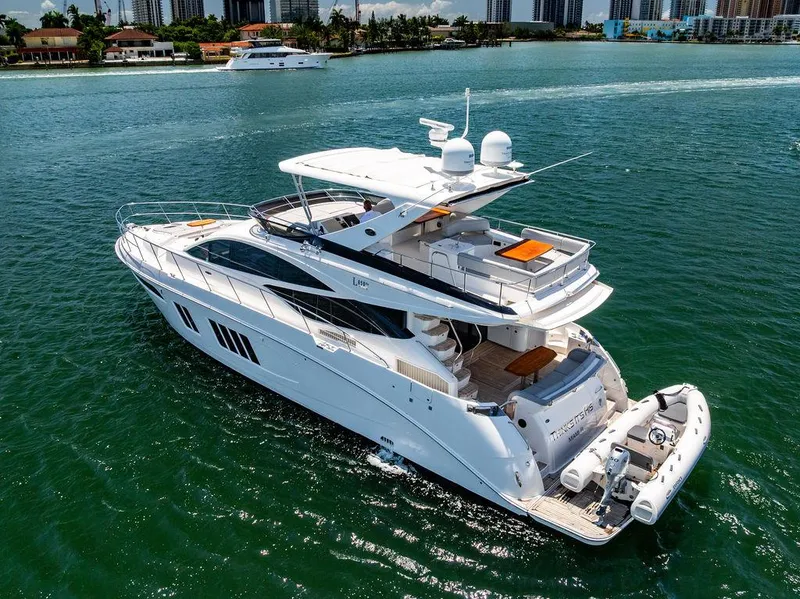 Slide: The Image of 2016 Sea Ray L650 Fly yacht cruising on clear blue water. - 8