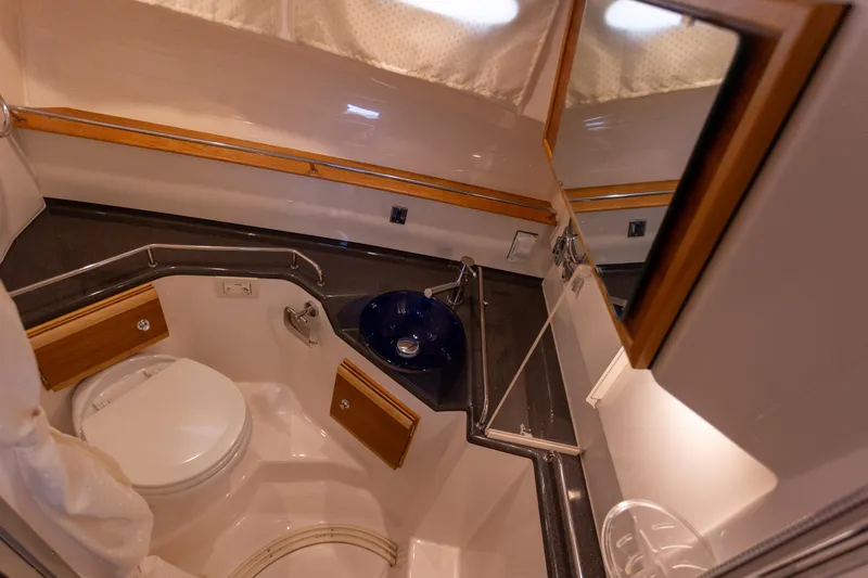 Slide: The Image of 2021 Cutwater C-32 CB boat bathroom with modern fixtures and compact design. - 33