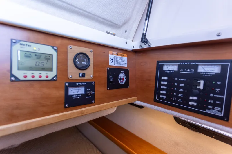Slide: The Image of Control panel of a 2021 Cutwater C-32 CB boat with various gauges and switches. - 36