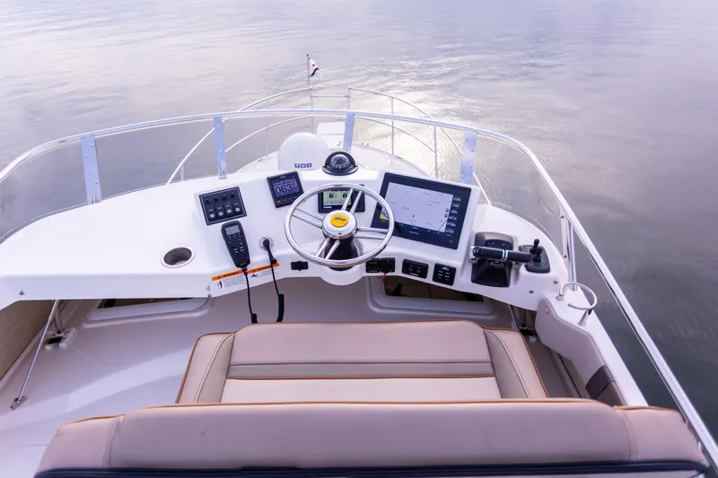 Slide: The Image of 2021 Cutwater C-32 CB helm with modern navigation equipment and comfortable seating. - 40