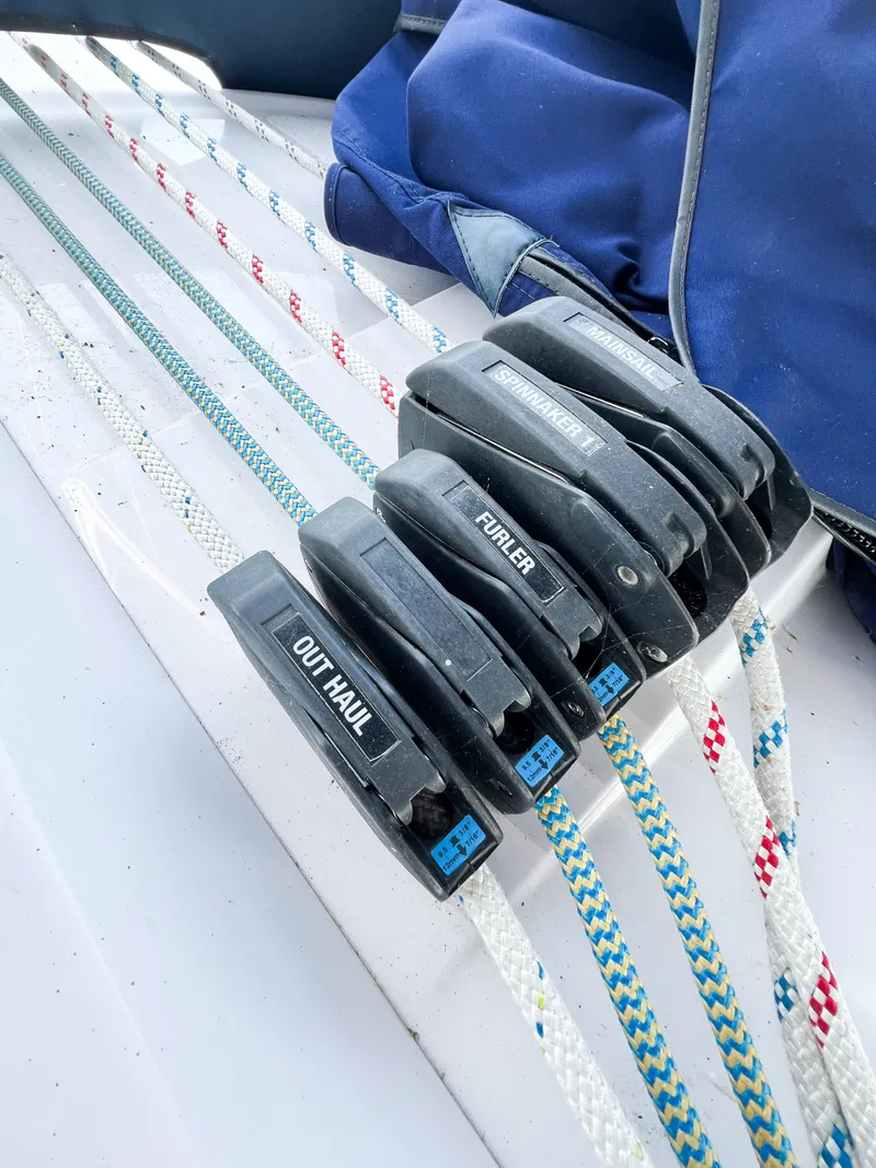 Slide: The Image of Sailboat rigging on a 2019 Catalina 425, featuring labeled rope clutches and colorful lines. - 10