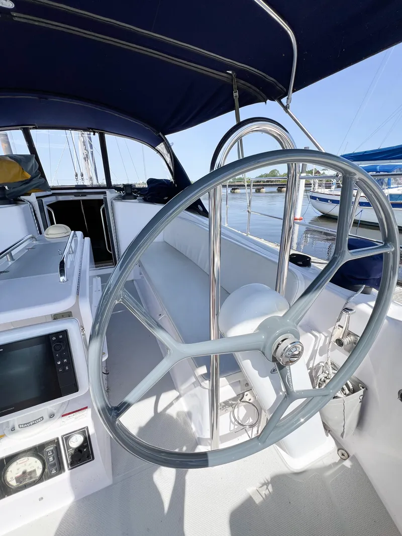 Slide: The Image of Steering wheel of a 2019 Catalina 425 sailboat, docked at a marina. - 14