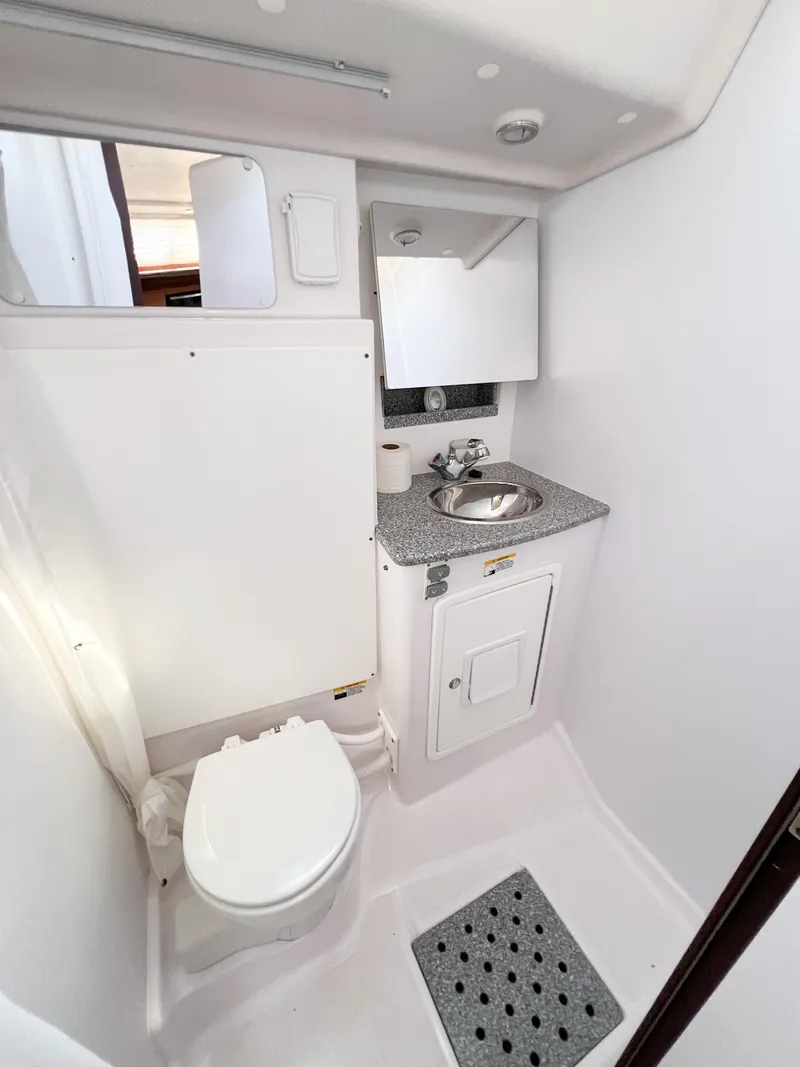 Slide: The Image of 2019 Catalina 425 yacht bathroom with sink, toilet, and mirror. - 22