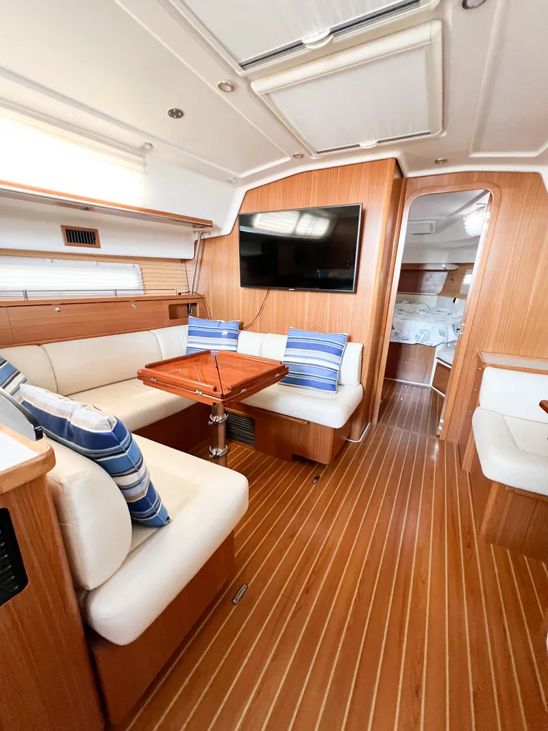 Slide: The Image of Interior of 2019 Catalina 425 yacht with wood finish, seating, and TV. - 25