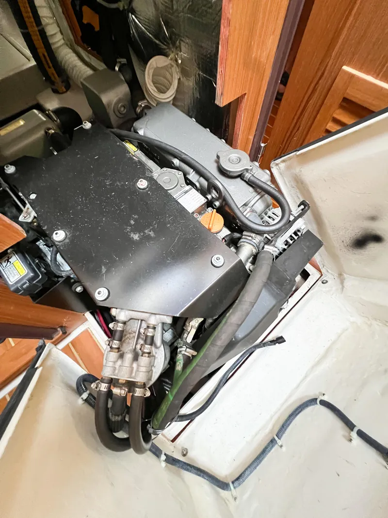 Slide: The Image of Engine compartment of a 2019 Catalina 425 sailboat, showcasing mechanical components and wiring. - 30