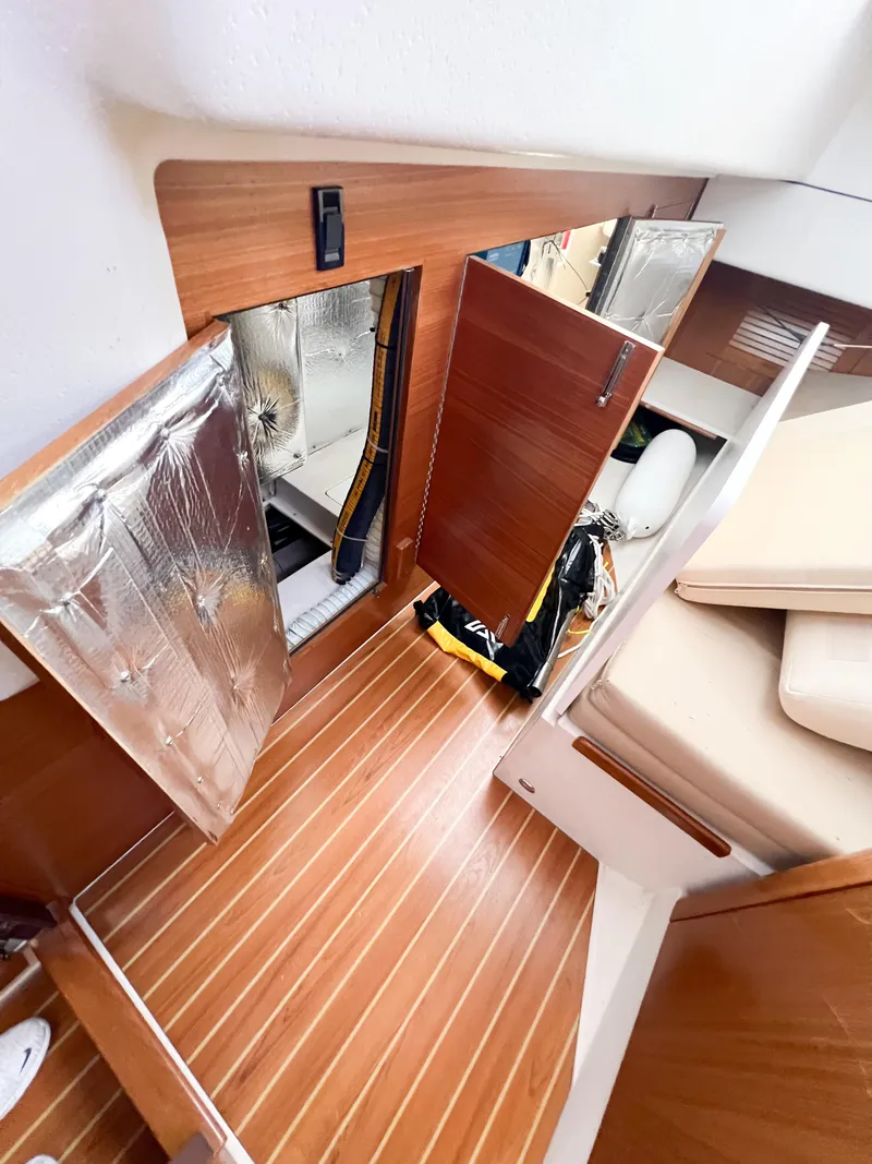 Slide: The Image of Interior of 2019 Catalina 425 sailboat with wooden flooring and storage compartments. - 32
