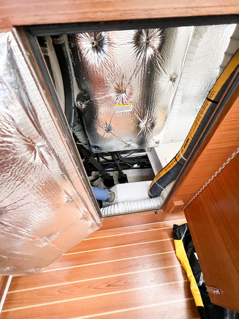 Slide: The Image of Engine compartment of 2019 Catalina 425 sailboat with insulation and wooden flooring. - 34
