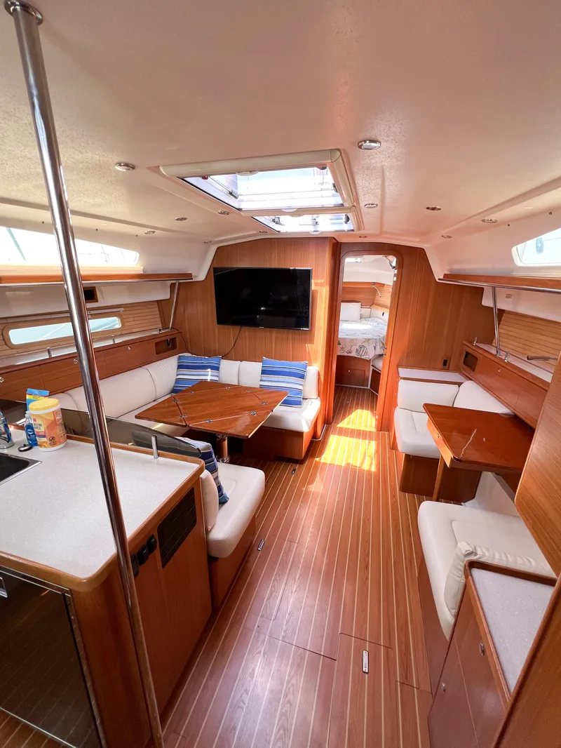 Slide: The Image of Interior of 2019 Catalina 425 yacht with modern furnishings and wood finish. - 39