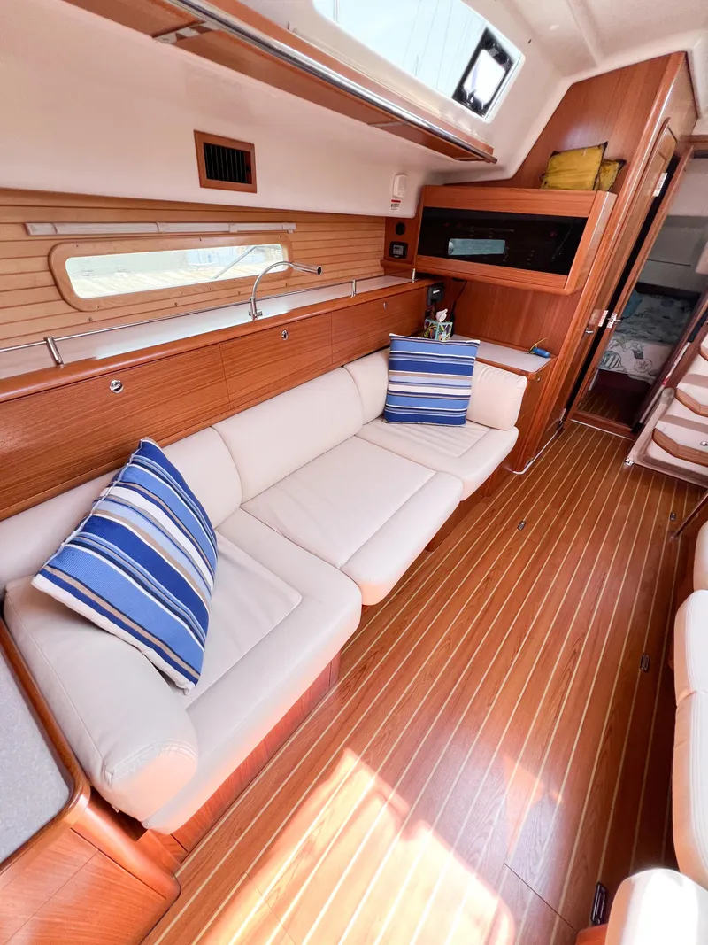 Slide: The Image of Interior of 2019 Catalina 425 yacht with wooden flooring and comfortable seating. - 43