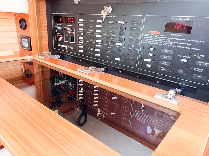 Slide: The Image of Electrical panel of a 2019 Catalina 425 yacht with wooden finish. - 46