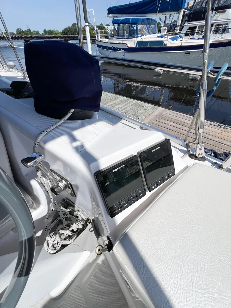 Slide: The Image of 2019 Catalina 425 yacht cockpit with navigation instruments, docked at marina. - 5
